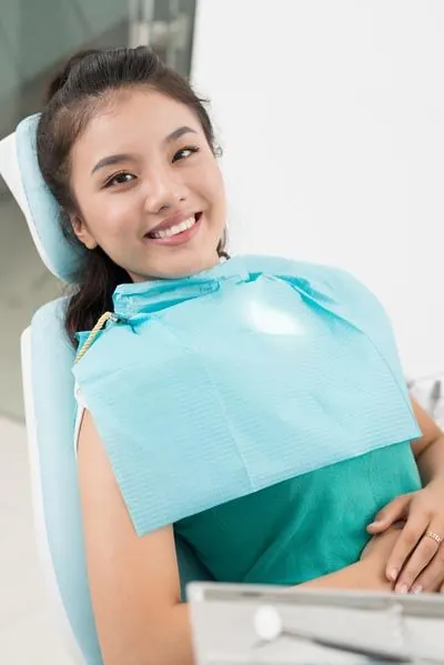 Jay Zimmerman Dentistry patient smiling during her cosmetic dentistry appointment