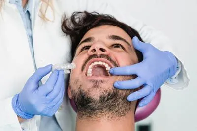 Jay Zimmerman Dentistry patient being fitted for his new Invisalign clear aligners